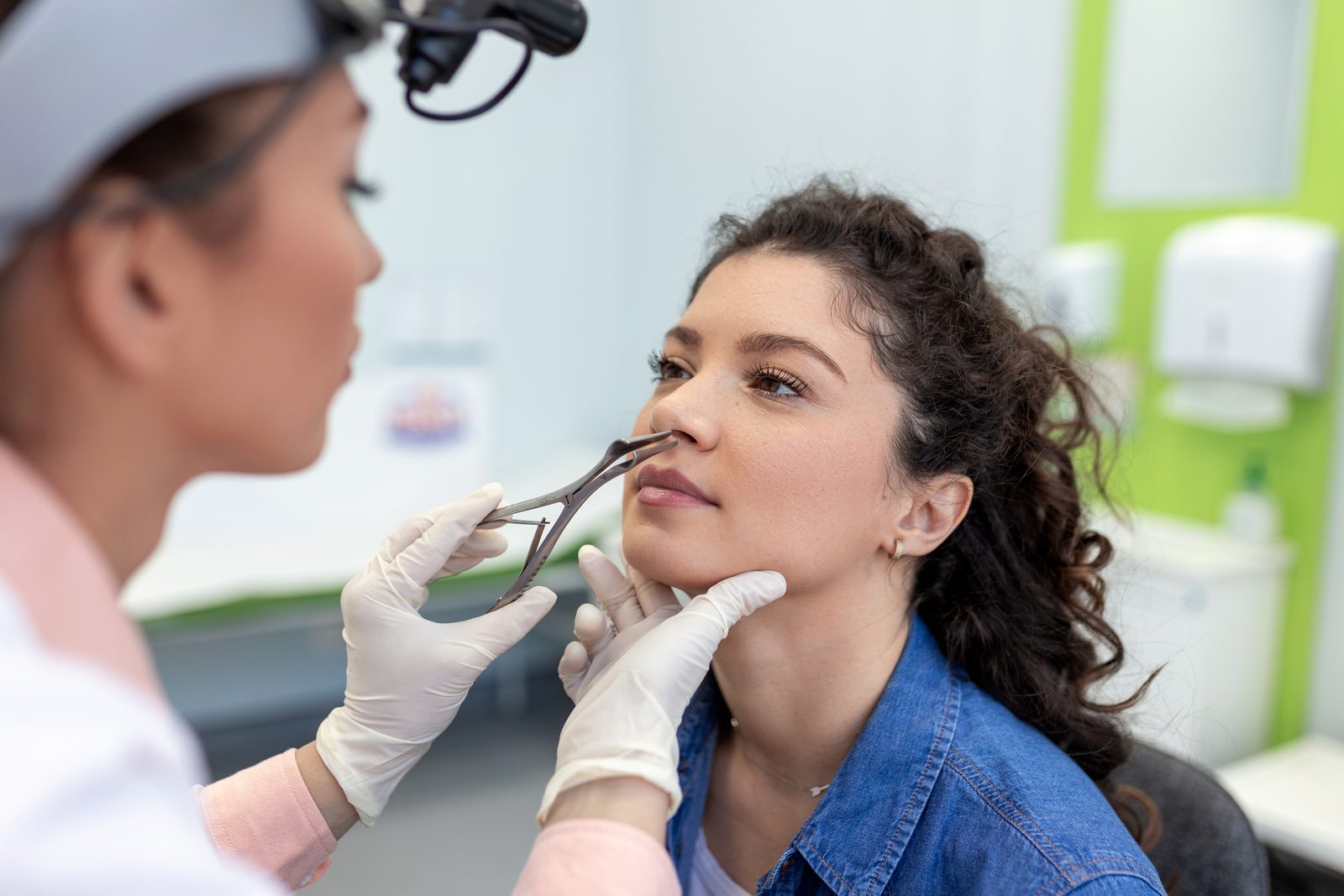 Primary ENT specialist examining a patient