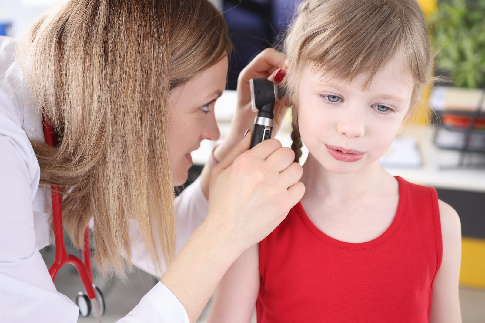 Primary ENT specialist examining a patient