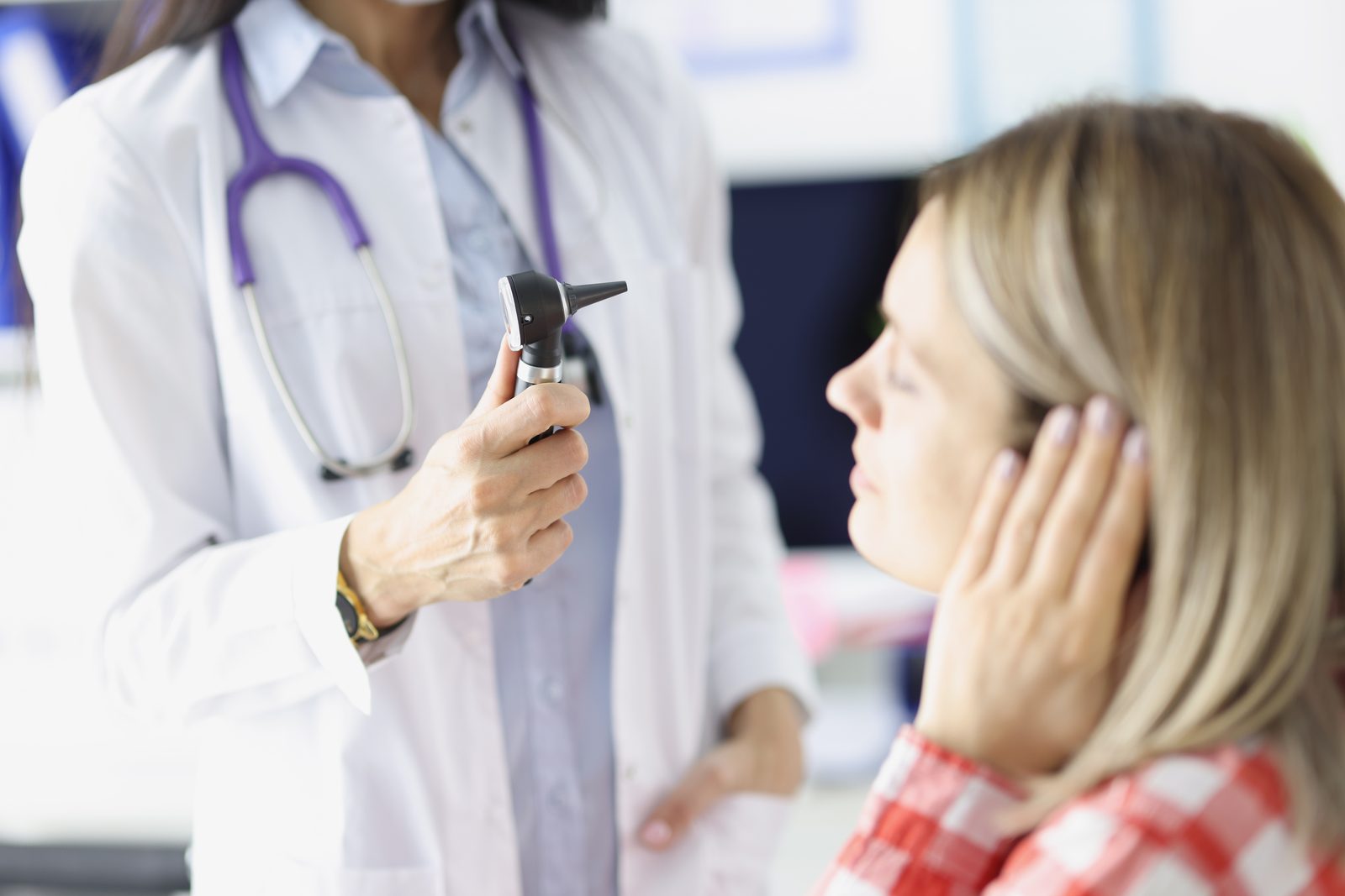 Primary ENT specialist examining a patient