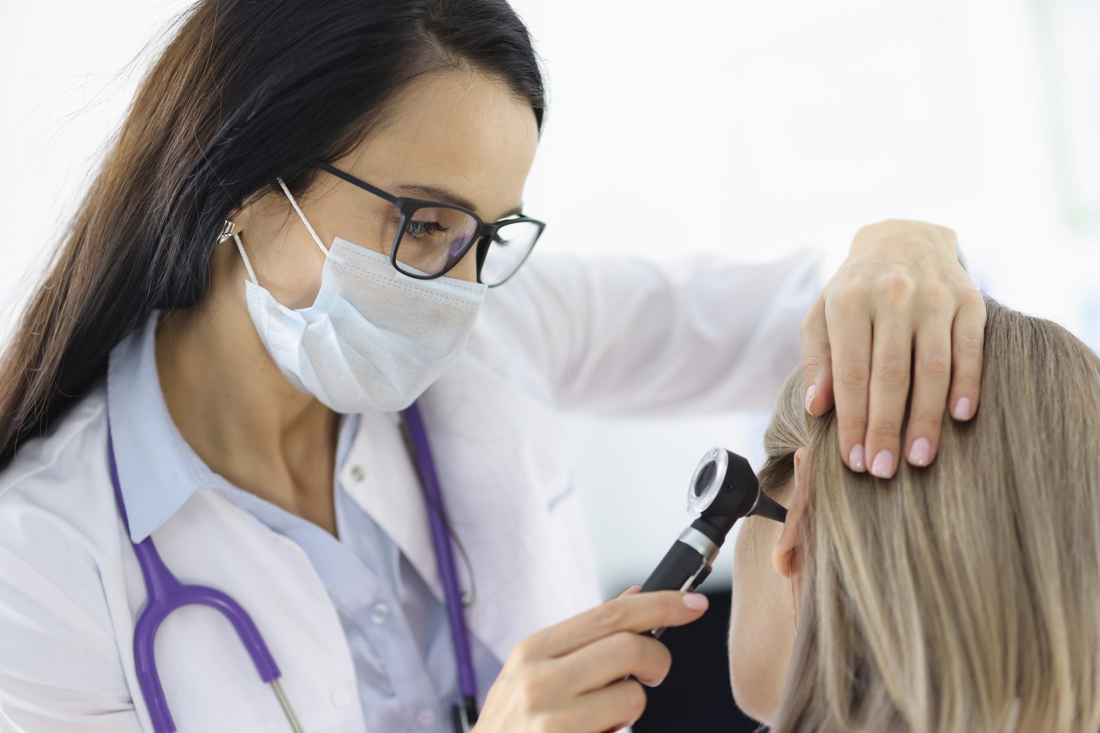 Primary ENT specialist examining a patient