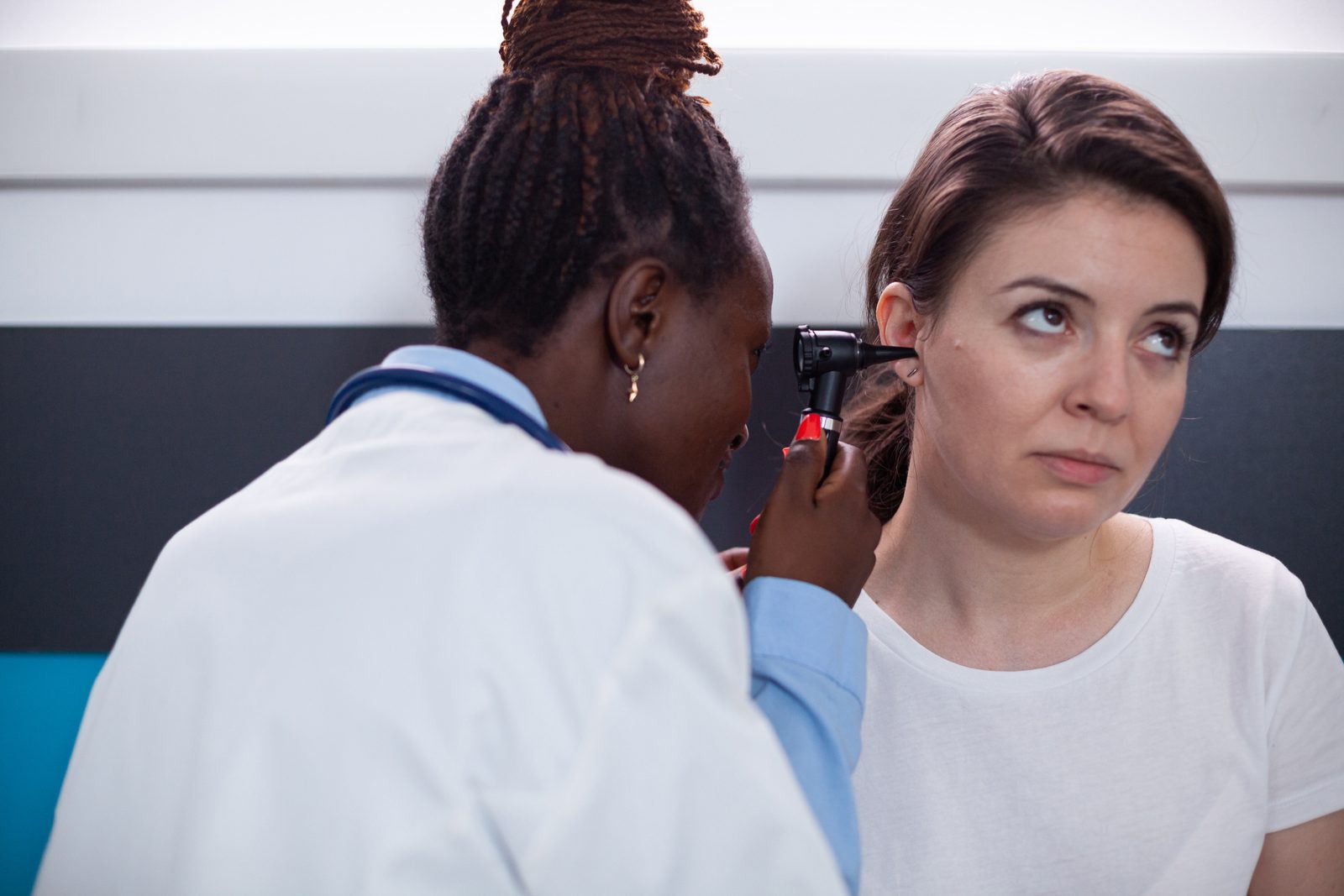 Primary ENT specialist examining a patient
