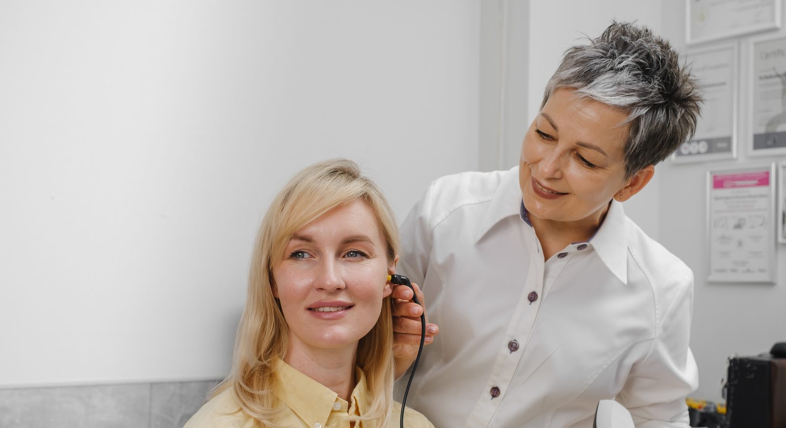 Primary ENT specialist examining a patient's ear